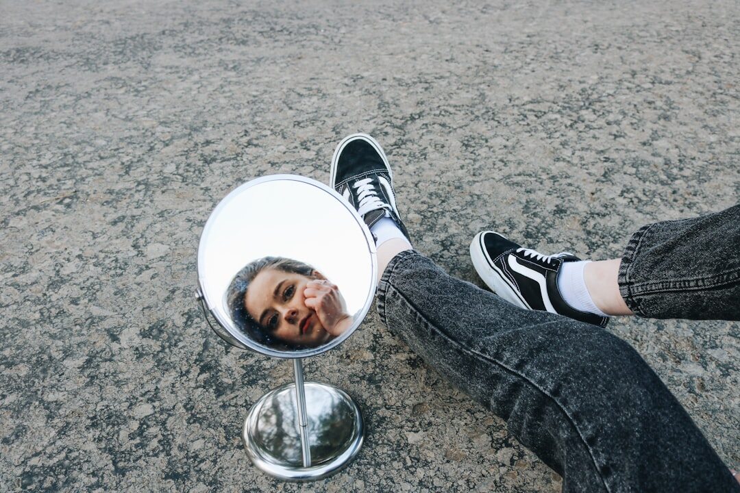 person reflecting in mirror