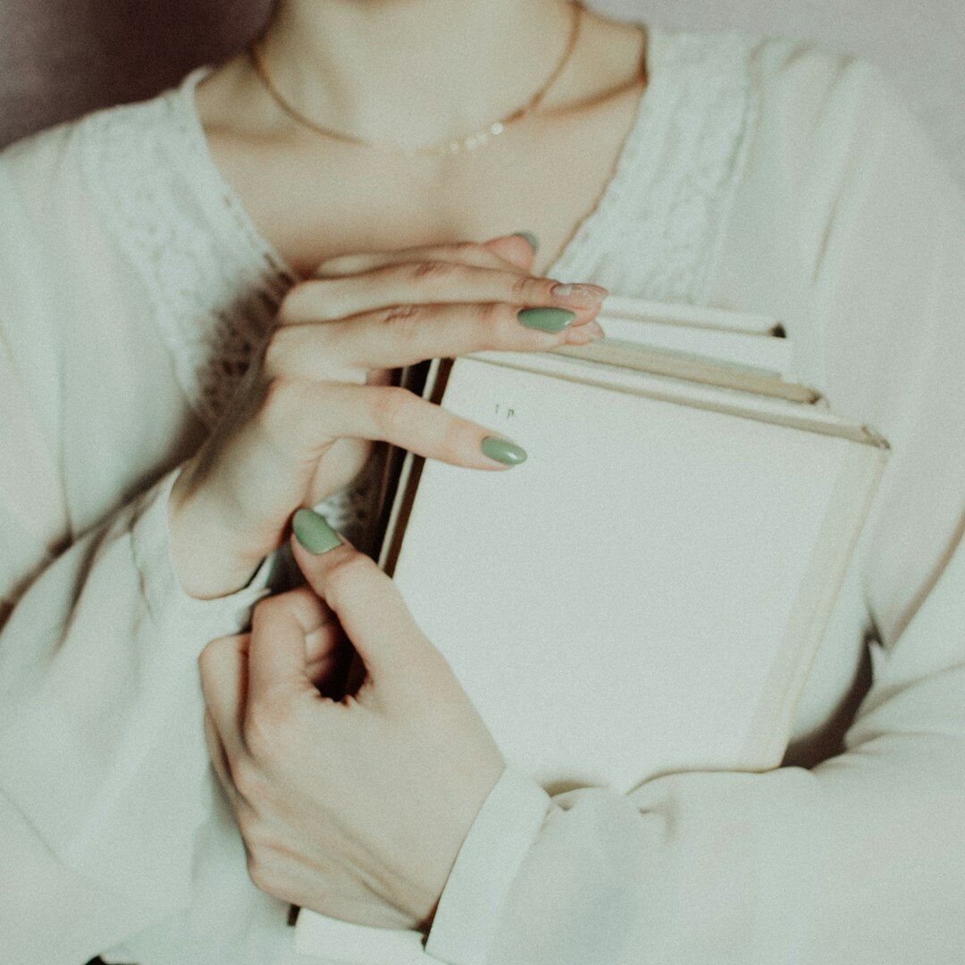 Woman writing notes while planning her personal development goals
