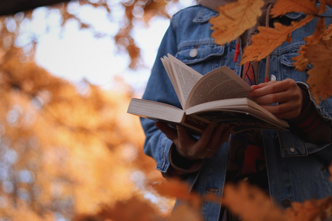 person reading book on communication